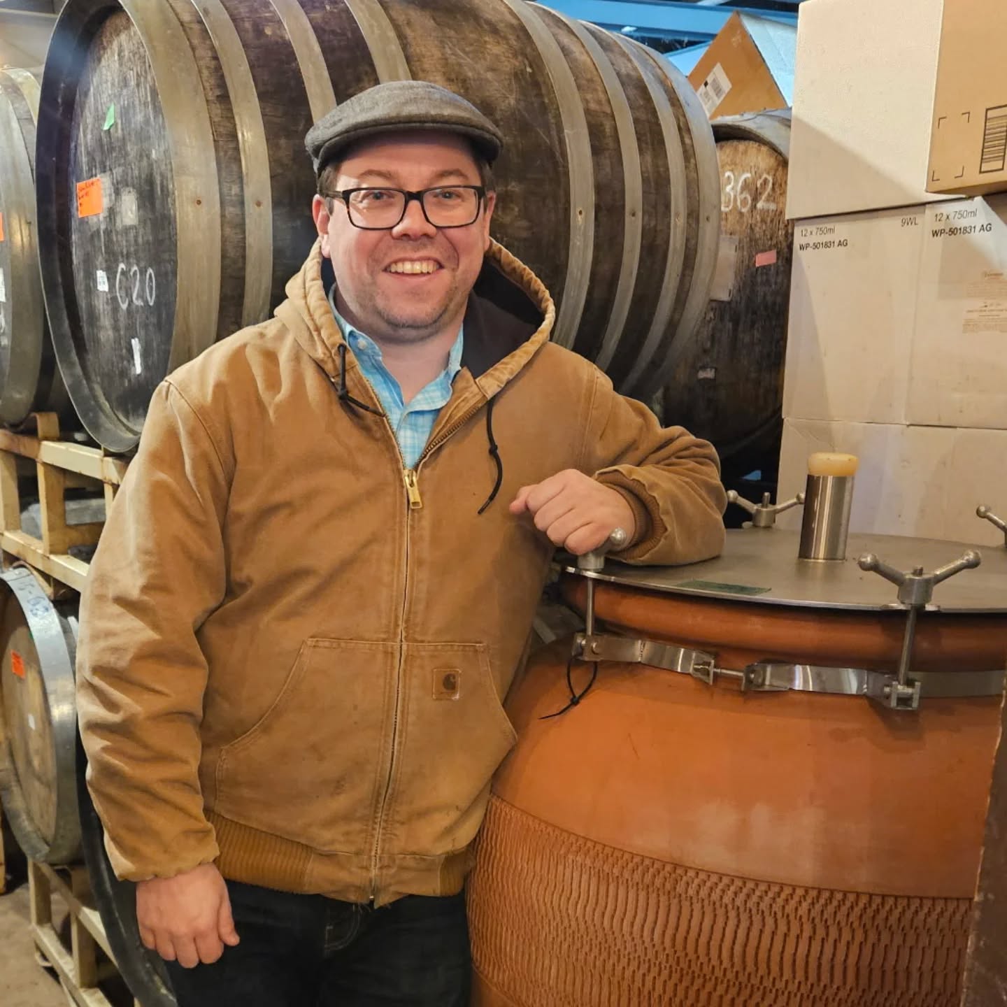 man posing in the barrel room