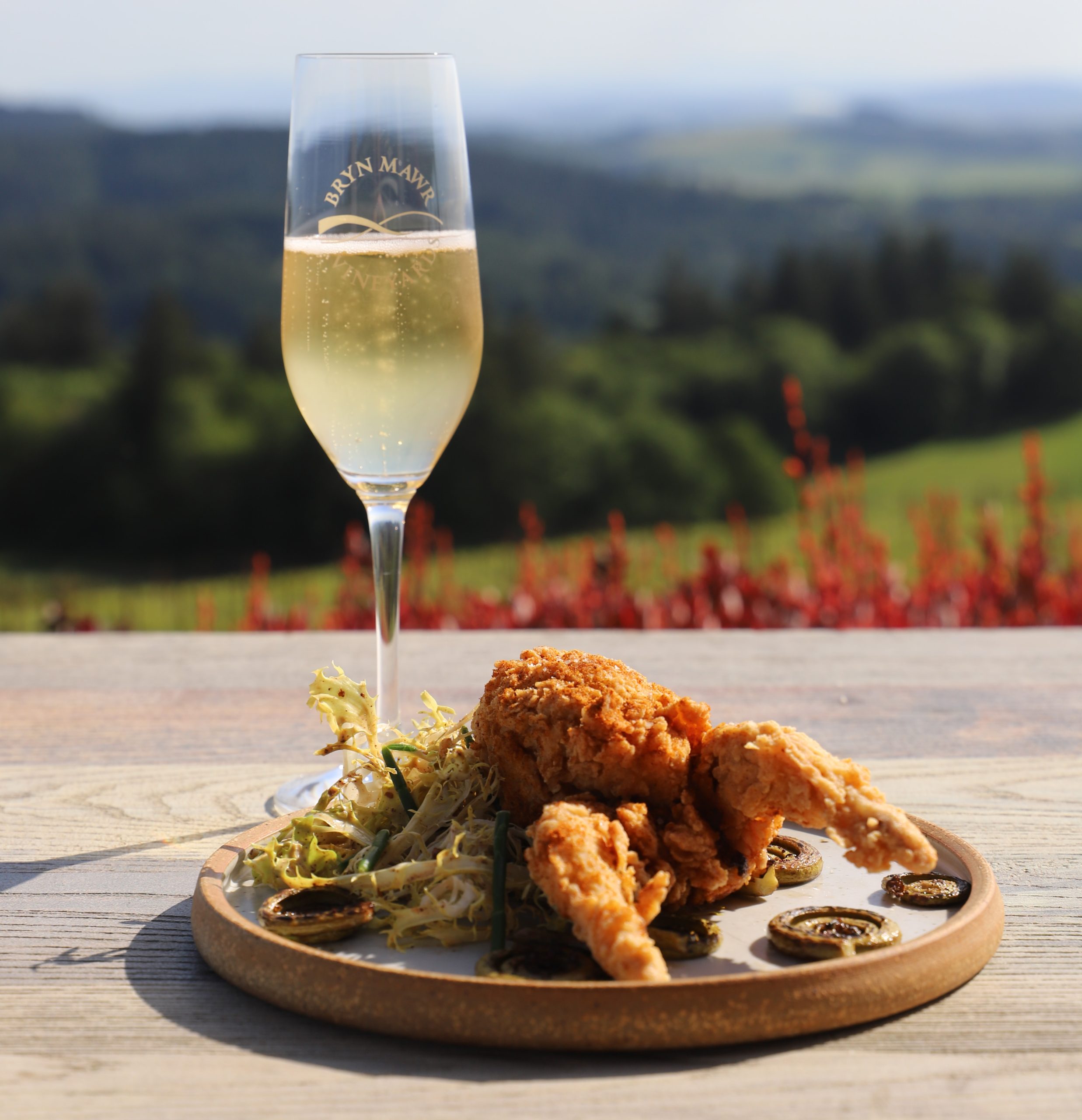 Plated appetizer and glass of sparkling wine